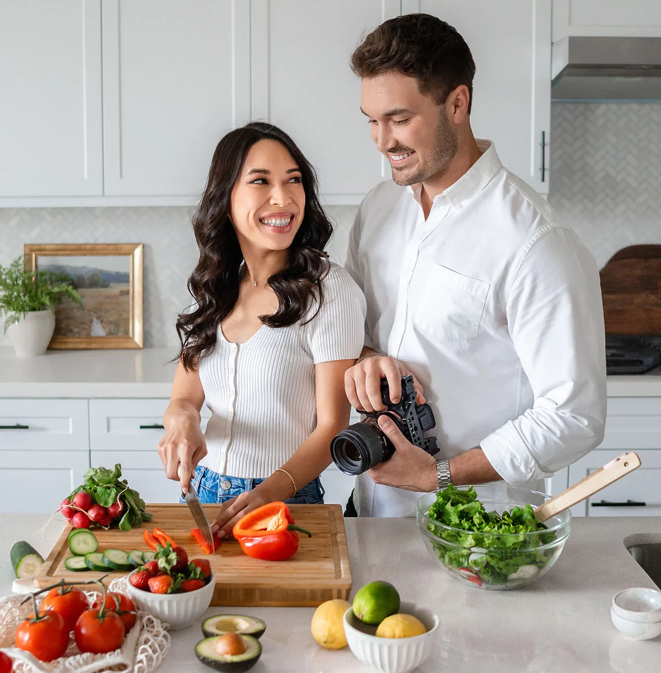 Megan and Eliezer in the kitchen.